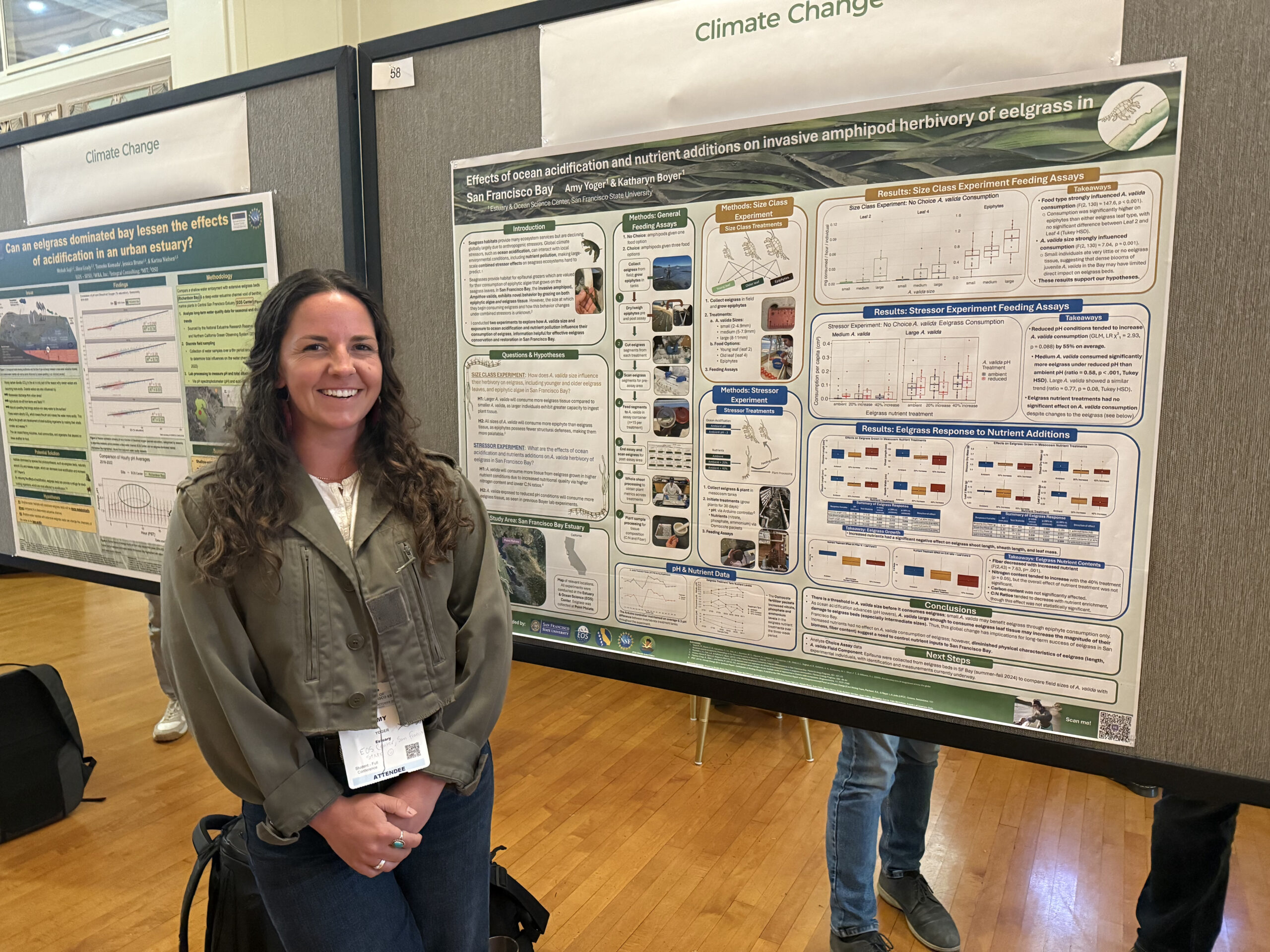 Amy Yoger stands in front of her 1st place winning poster at the 2025 State of the Estuary Conference