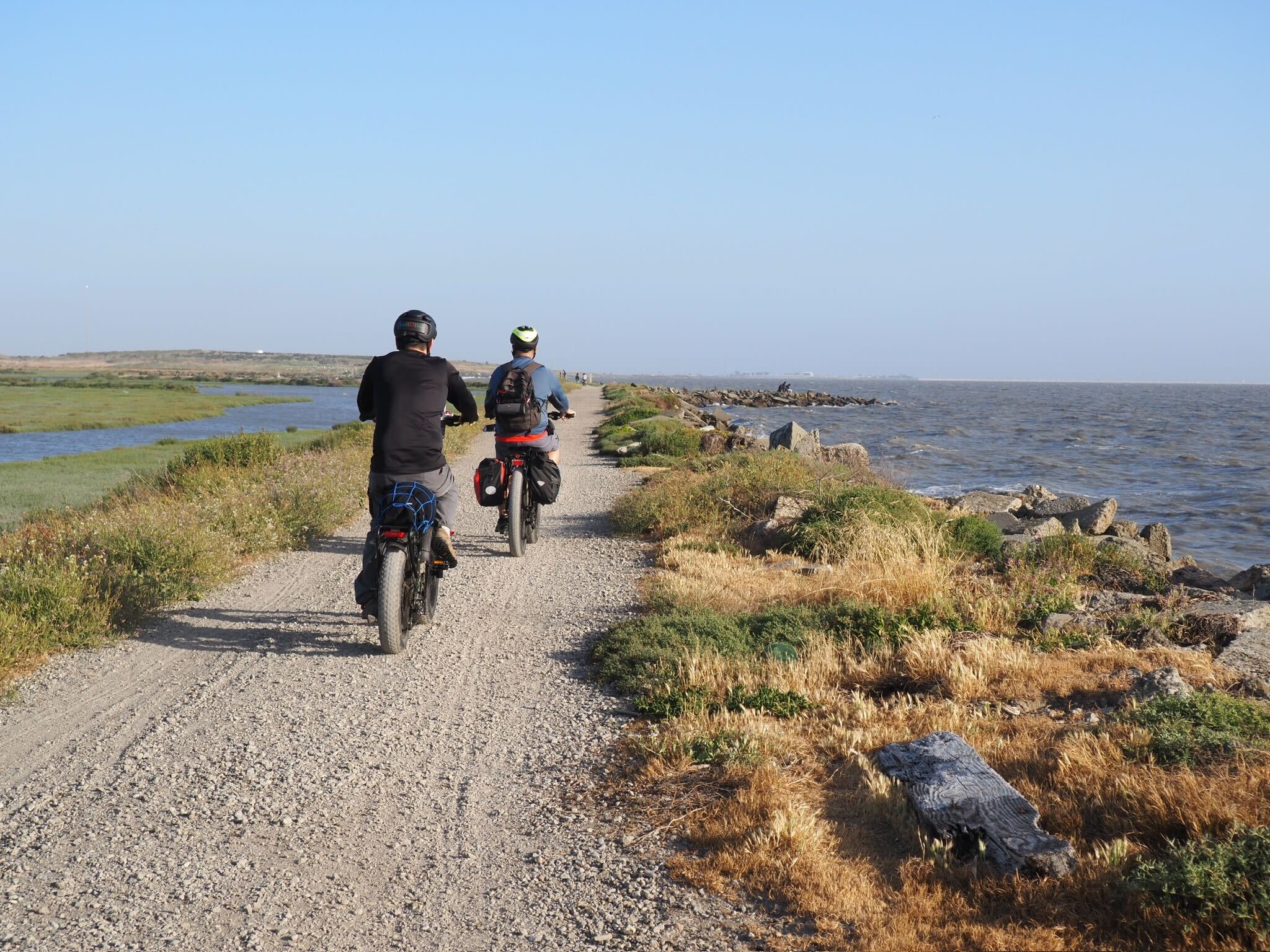 Alex_Thomsen People are riding mountain bikes along the water