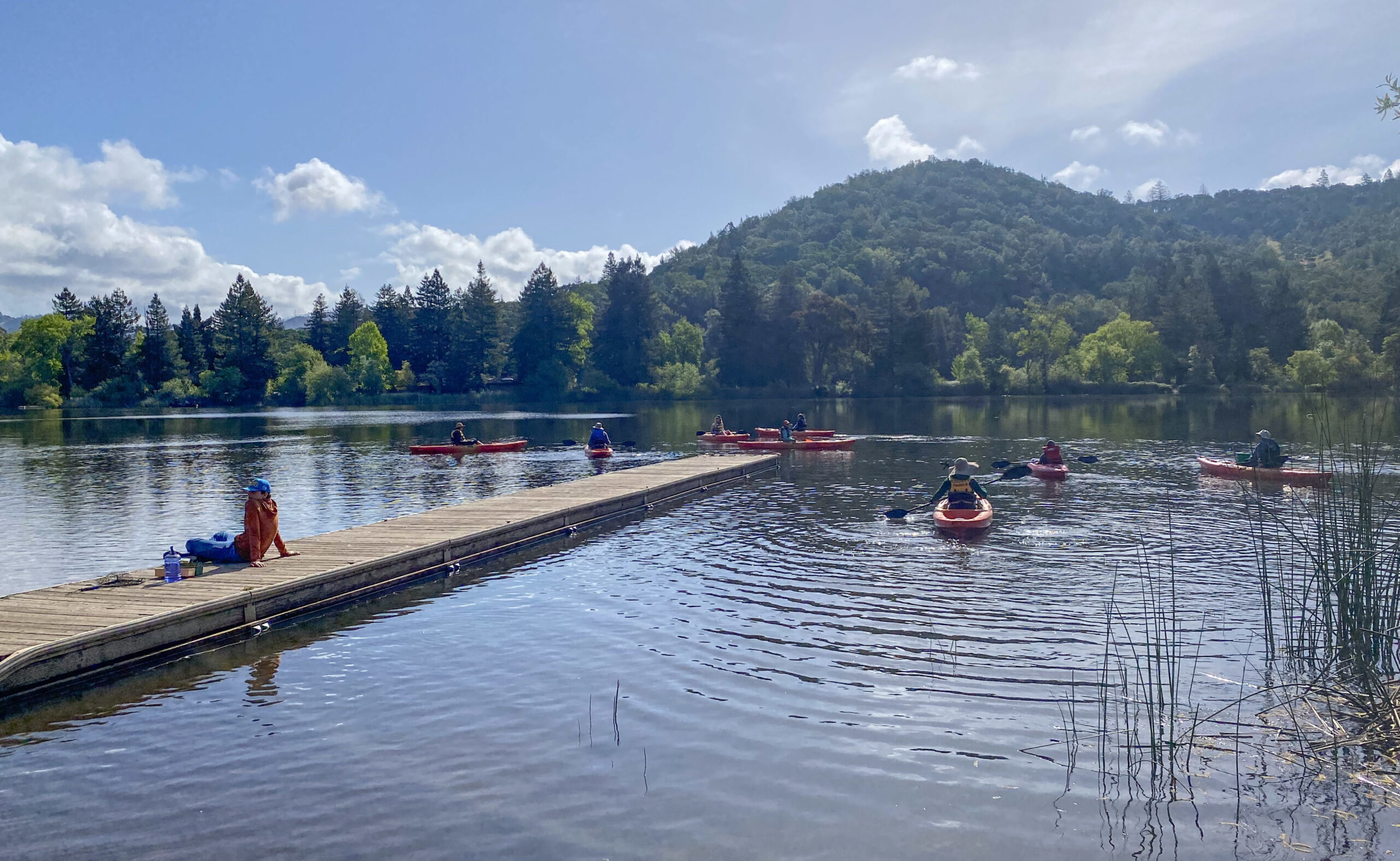 Photo of people enjoying the water in Sonoma - photo by Ben Botkin People enjoying the water while in kayaks or sitting on the dock.